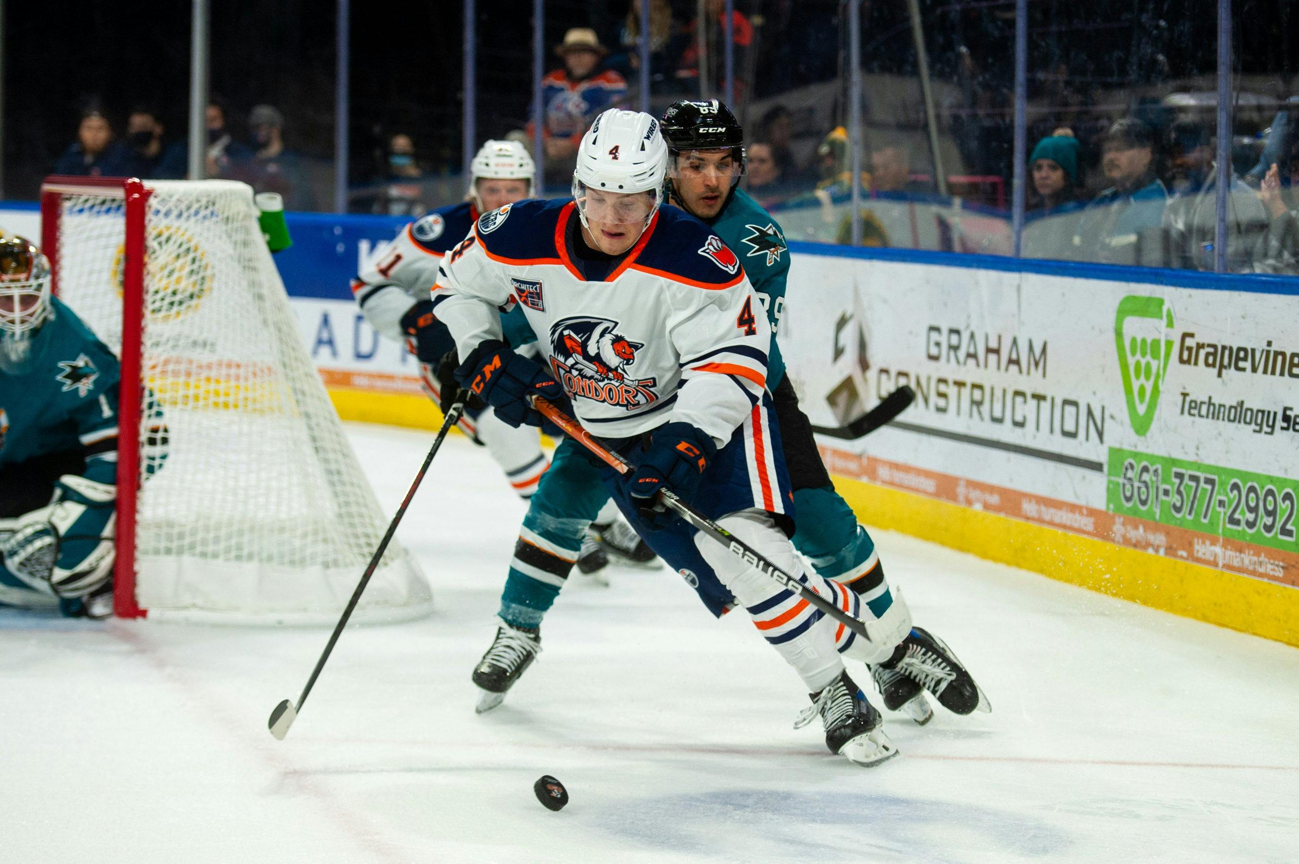 Edmonton Oilers' Dylan Holloway (55) gets up after a hit as Oilers