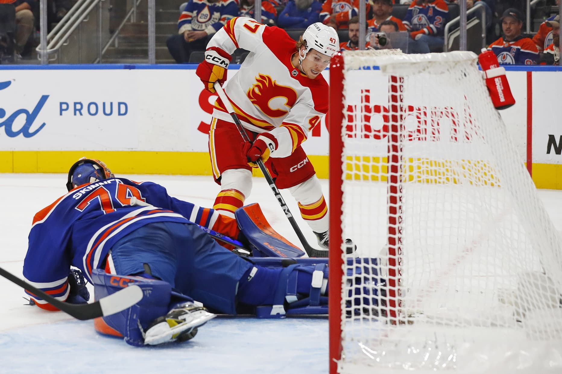 Edmonton Oilers Stuart Skinner gets scored on by Calgary Flame