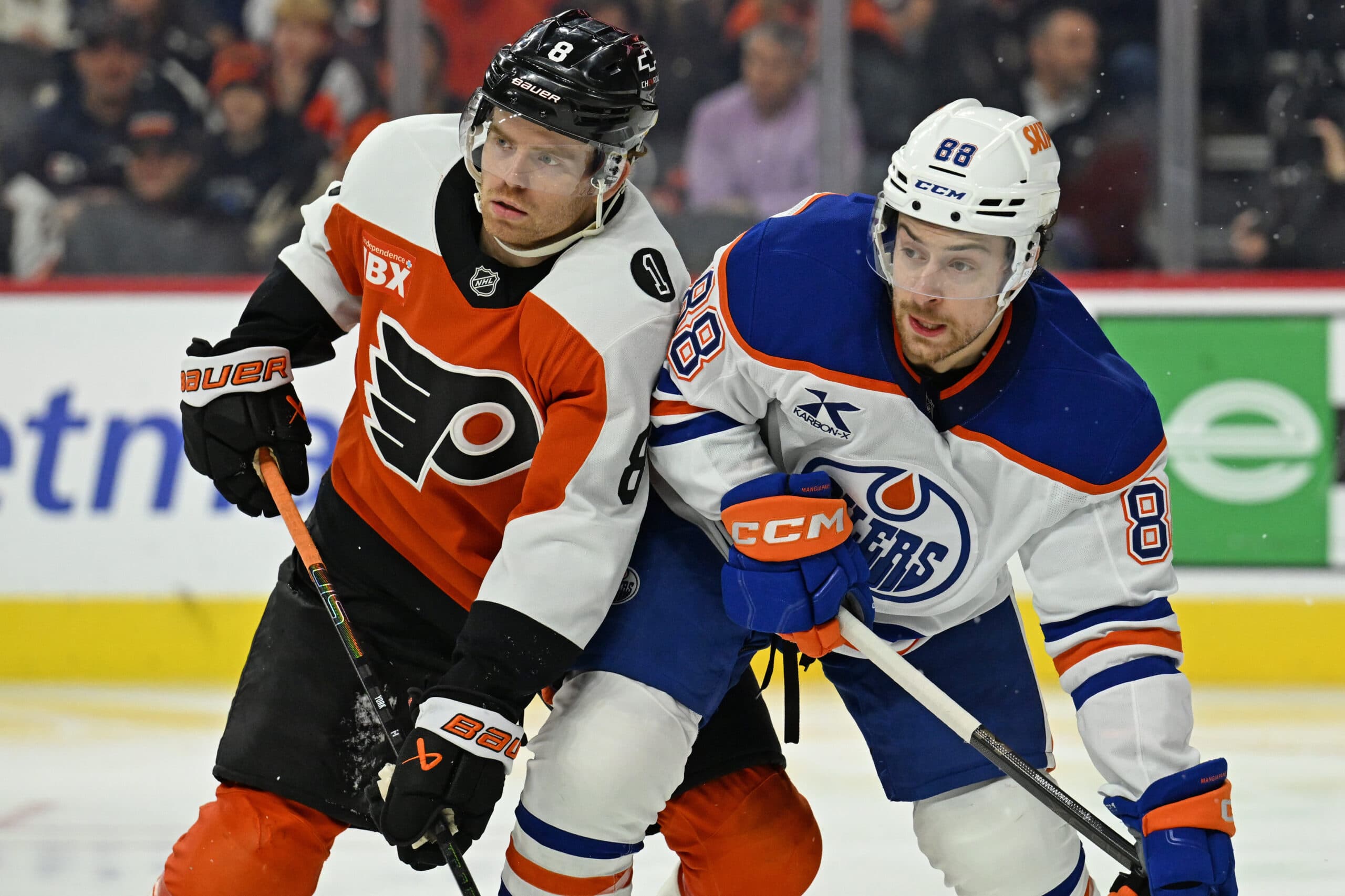 Nov 12, 2025; Philadelphia, Pennsylvania, USA; Philadelphia Flyers defenseman Cam York (8) and Edmonton Oilers left wing Andrew Mangiapane (88) battle for position at Xfinity Mobile Arena. Mandatory Credit: Eric Hartline-Imagn Images.