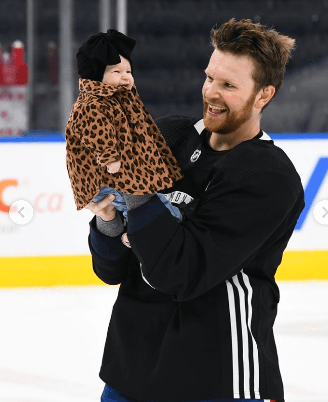 Brett Kulak and his daughter