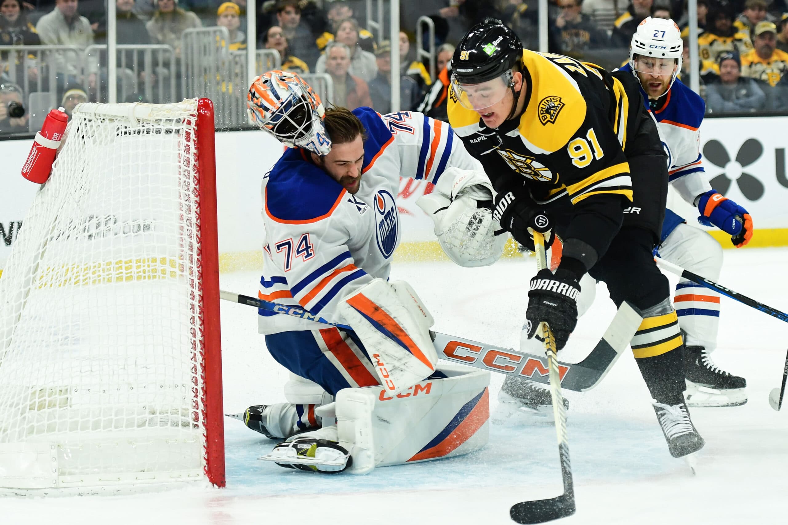 Edmonton Oiler Stuart Skinner hit by Boston Bruins Nikita Zadorov
