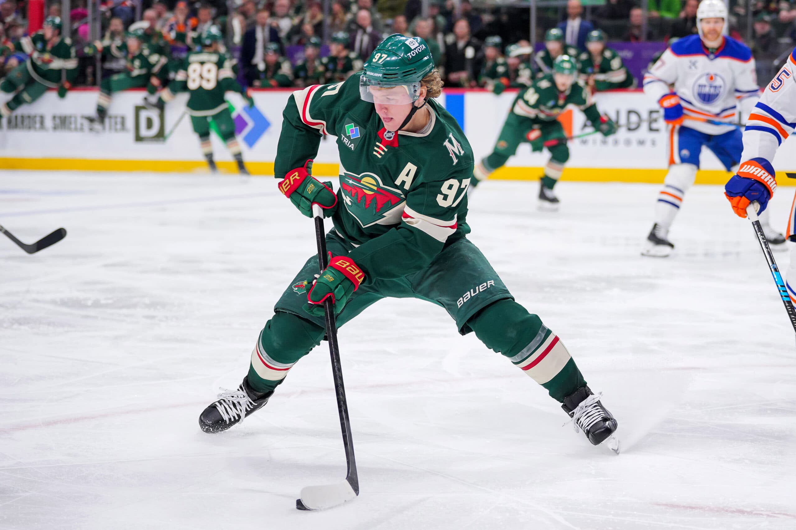 Dec 12, 2024; Saint Paul, Minnesota, USA; Minnesota Wild left wing Kirill Kaprizov (97) skates with the puck against the Edmonton Oilers in the second period at Xcel Energy Center. Mandatory Credit: Brad Rempel-Imagn Images