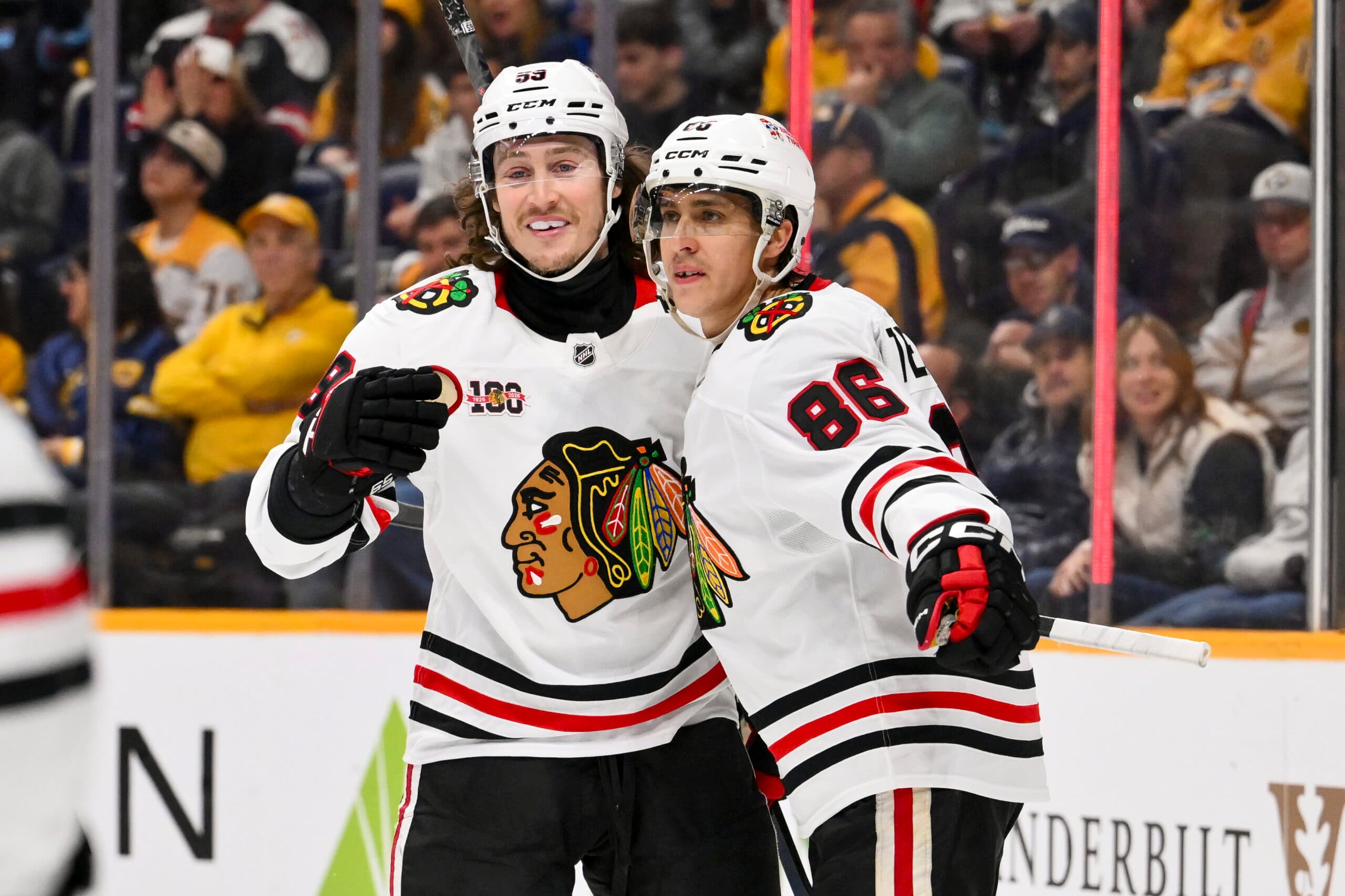 Jan 10, 2026; Nashville, Tennessee, USA; Chicago Blackhawks left wing Tyler Bertuzzi (59) celebrates a goal with center Teuvo Teravainen (86) against the Nashville Predators during the second period at Bridgestone Arena. Mandatory Credit: Steve Roberts-Imagn Images