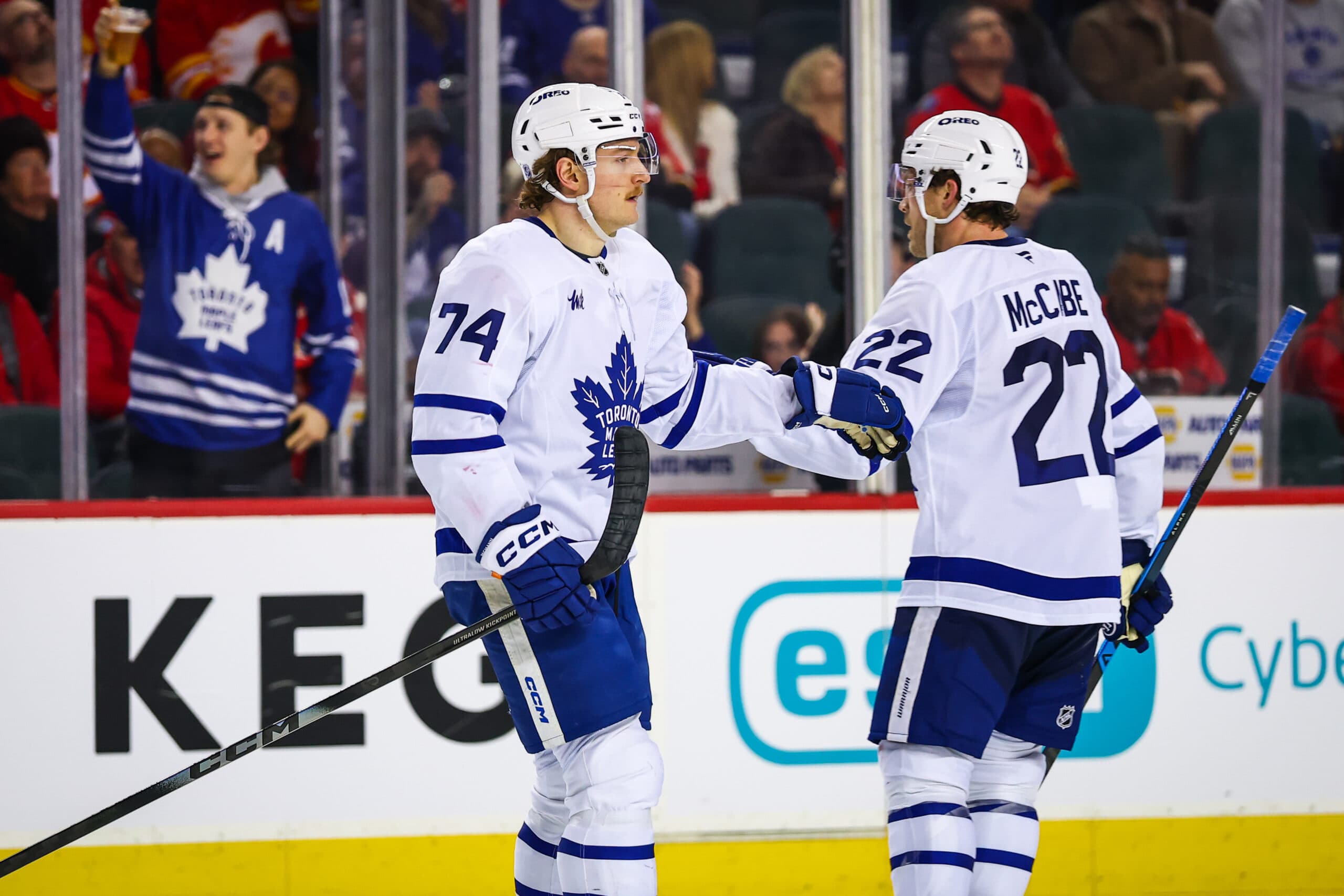 Feb 2, 2026; Calgary, Alberta, CAN; Toronto Maple Leafs center Bobby McMann (74) celebrates his goal with teammates against the Calgary Flames during the third period at Scotiabank Saddledome. Mandatory Credit: Sergei Belski-Imagn Images